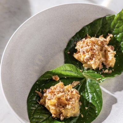 Plate of tuna crudo served on betel leaves